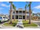 Beautiful community clubhouse framed by palm trees with a walkway leading to the entrance at 2237 Tillage St, Mount Pleasant, SC 29466