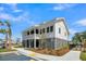 Charming two-story clubhouse with a classic design, ample parking, and beautifully landscaped grounds, ideal for community events at 2237 Tillage St, Mount Pleasant, SC 29466