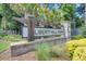 Entrance sign to Liberty Hill Farm framed by mature trees, shrubs, and green lawn at 2237 Tillage St, Mount Pleasant, SC 29466