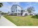 Bright and airy two-story home exterior with a well-maintained lawn and lovely landscaping at 2237 Tillage St, Mount Pleasant, SC 29466