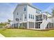 Charming home with light blue siding, landscaped yard, and a screened-in porch at 2237 Tillage St, Mount Pleasant, SC 29466