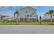 Coastal home exterior featuring a lush yard and inviting stairway entrance at 2237 Tillage St, Mount Pleasant, SC 29466