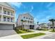 Beautiful two-story home with a garage, multi-level porches, well-manicured lawn and garden, plus mature palm trees at 2237 Tillage St, Mount Pleasant, SC 29466