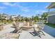 Inviting outdoor fire pit with seating, perfect for gatherings and enjoying the neighborhood views on a clear day at 2237 Tillage St, Mount Pleasant, SC 29466