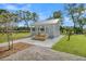 Open-air gazebo with a metal roof, wooden benches, and lush green space at 2237 Tillage St, Mount Pleasant, SC 29466