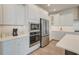 Well-lit kitchen features stainless appliances and white cabinets, oven, microwave and refrigerator, and a white countertop at 2237 Tillage St, Mount Pleasant, SC 29466
