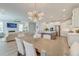 Open concept living and dining area with modern kitchen, a fireplace and flat-screen television, and hardwood floors at 2237 Tillage St, Mount Pleasant, SC 29466