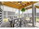 Inviting screened patio with brick floors, comfortable seating, and a ceiling fan at 2237 Tillage St, Mount Pleasant, SC 29466