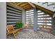 Covered patio with brick floors, chairs, a fern, and privacy screen at 2237 Tillage St, Mount Pleasant, SC 29466