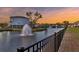 Peaceful pond view with water fountains, set against a beautiful sunset at 2237 Tillage St, Mount Pleasant, SC 29466