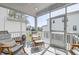 Comfortable screened-in porch with stylish seating and views of the landscaped yard at 2237 Tillage St, Mount Pleasant, SC 29466