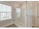 Modern glass shower with white subway tile, a built-in bench, and a window for natural light at 2237 Tillage St, Mount Pleasant, SC 29466