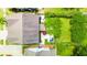 Aerial view of backyard, showcasing patio, green lawn, and privacy hedges at 2254 Show Basket Way, Mount Pleasant, SC 29466