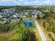 Aerial view of the community, revealing tennis courts, ponds, and tree-lined streets at 2632 Private Lefler Dr, Johns Island, SC 29455