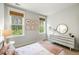 Bright bedroom with windows, pink accents, and lots of natural light at 2632 Private Lefler Dr, Johns Island, SC 29455