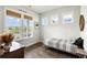 Bedroom featuring hard wood floors and multiple windows overlooking the water at 2632 Private Lefler Dr, Johns Island, SC 29455