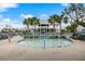 Community pool surrounded by palm trees, lounge chairs, and a covered pavilion at 2632 Private Lefler Dr, Johns Island, SC 29455