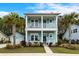 Charming two-story home with inviting double porches and beautifully landscaped front yard at 2632 Private Lefler Dr, Johns Island, SC 29455