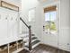 Bright foyer with coat rack, bench, and view of the neighborhood at 2632 Private Lefler Dr, Johns Island, SC 29455