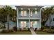 Inviting two-story home with double porches, palm trees, and lush landscaping at 2632 Private Lefler Dr, Johns Island, SC 29455