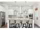 Bright kitchen features a large island with seating and modern stainless steel appliances at 2632 Private Lefler Dr, Johns Island, SC 29455