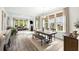 Open-concept living room and dining area with fireplace and ample natural light at 2632 Private Lefler Dr, Johns Island, SC 29455