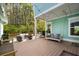 Back patio with a porch swing, outdoor seating and fire pit at 2632 Private Lefler Dr, Johns Island, SC 29455