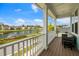 Relaxing porch with views of a pond, comfortable seating and nice railing at 2632 Private Lefler Dr, Johns Island, SC 29455