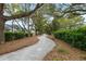 Enjoy the outdoors with a peaceful tree-lined walking path and lush landscaping at 2632 Private Lefler Dr, Johns Island, SC 29455
