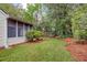 Beautiful backyard with a covered patio, lush greenery, and room for outdoor enjoyment at 2777 Forest Dew Ct, Charleston, SC 29414