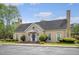Attractive clubhouse with stone accents, surrounded by manicured landscaping and a paved parking area at 2777 Forest Dew Ct, Charleston, SC 29414