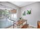 Sunlit dining area with a wooden table and bench seating at 2777 Forest Dew Ct, Charleston, SC 29414