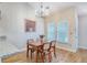 Inviting dining area with a chandelier and views of the surrounding neighborhood at 2777 Forest Dew Ct, Charleston, SC 29414