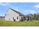 Backyard with a screened porch, green space, and mature trees at 280 Swamp Creek Ln, Moncks Corner, SC 29461