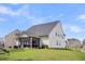 Backyard with a screened porch, green space, and play equipment at 280 Swamp Creek Ln, Moncks Corner, SC 29461