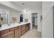 Bathroom with dual sink vanity, large mirror, and access to walk-in closets at 280 Swamp Creek Ln, Moncks Corner, SC 29461