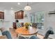 Cozy breakfast nook with seating and a view of the screened porch and wooded yard at 280 Swamp Creek Ln, Moncks Corner, SC 29461