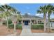 Community clubhouse featuring palm trees and an attractive entrance at 280 Swamp Creek Ln, Moncks Corner, SC 29461