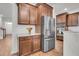 Spacious kitchen with stainless steel appliances, granite countertops, and dark wood cabinetry at 280 Swamp Creek Ln, Moncks Corner, SC 29461