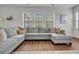 Comfortable living area featuring a large gray sectional sofa and bright windows at 280 Swamp Creek Ln, Moncks Corner, SC 29461