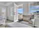 Bedroom chair with door opening to a balcony with neighborhood views at 280 Swamp Creek Ln, Moncks Corner, SC 29461