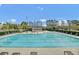 Large community swimming pool with plenty of lounge chairs and a clubhouse at 280 Swamp Creek Ln, Moncks Corner, SC 29461