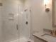 Modern bathroom featuring a marble vanity, decorative mirror, and frameless glass shower with gold hardware at 295 W Coleman Blvd, Mount Pleasant, SC 29464