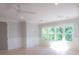 Bright bedroom with large windows providing natural light, ceiling fan, and neutral wall colors at 295 W Coleman Blvd, Mount Pleasant, SC 29464