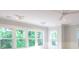 Sun-filled bedroom with large windows providing lush green views, recessed lighting, and ceiling fan at 295 W Coleman Blvd, Mount Pleasant, SC 29464