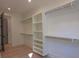 Bright, walk-in closet with custom shelving and hanging rods for optimal organization and storage at 295 W Coleman Blvd, Mount Pleasant, SC 29464