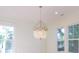 Dining room featuring natural light with an elegant chandelier between two large windows at 295 W Coleman Blvd, Mount Pleasant, SC 29464