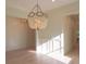 Spacious dining room featuring hardwood floors, a statement chandelier, and white wainscoting at 295 W Coleman Blvd, Mount Pleasant, SC 29464