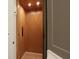 Spacious home elevator featuring wood paneling, recessed lighting, and a sleek control panel for modern convenience at 295 W Coleman Blvd, Mount Pleasant, SC 29464
