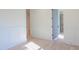 Hallway featuring white wainscoting and light wood floors, with an open doorway to another room at 295 W Coleman Blvd, Mount Pleasant, SC 29464